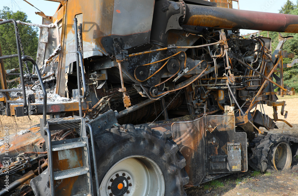 Fototapeta premium Combine harvester destroyed by fire