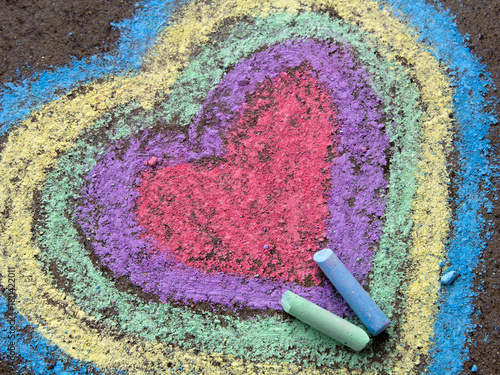chalk drawing: colorful hearts on asphalt