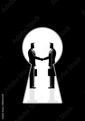 Businessmen shaking hands seen through a keyhole