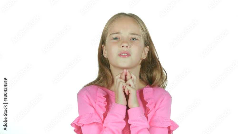 Child crosses his fingers, she hopes to win. White background Child crosses his fingers, she hopes to win. White background
