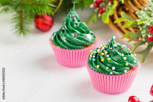 Christmas green cupcakes with festive decorations