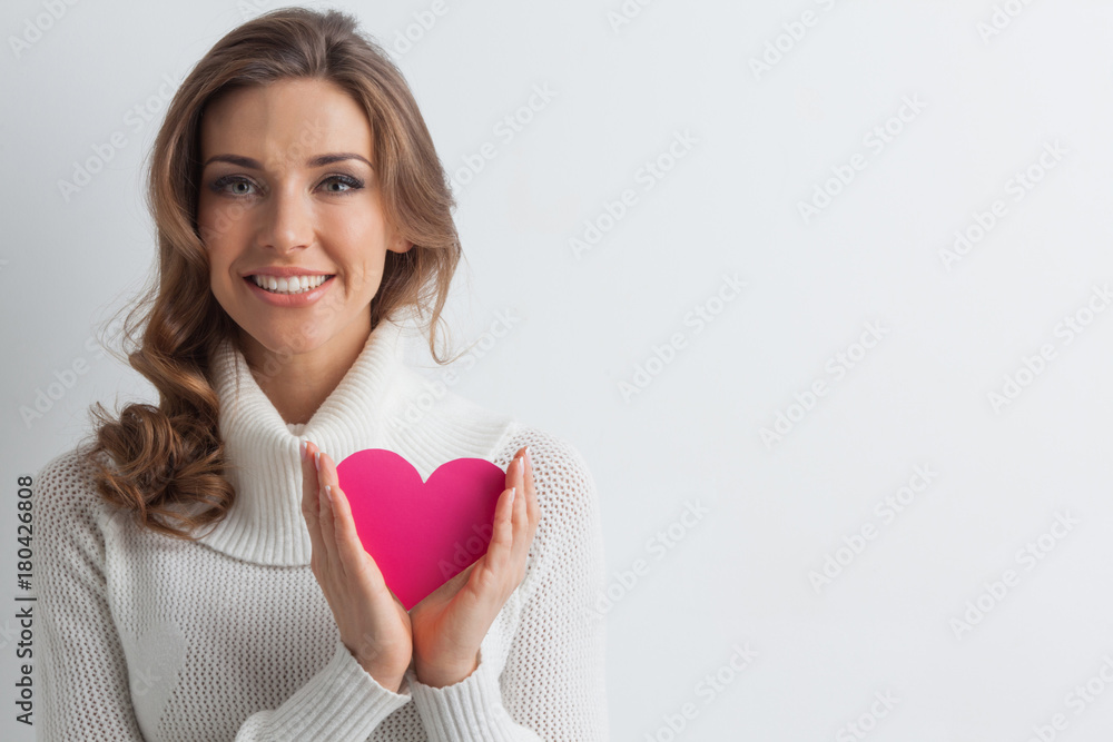 Smiling woman with paper heart Smiling woman with paper heart