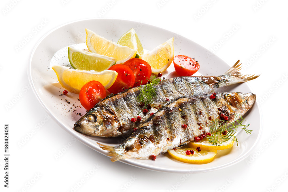 Fish dish - grilled herrings with vegetables Fish dish - grilled herrings with vegetables