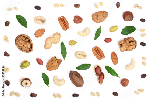 mix of different nuts with leaves isolated on white background, Flat lay pattern, Top view