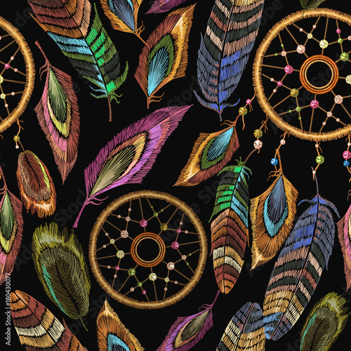 Embroidery dreamcatcher boho seamless pattern. Native american indian talisman dream catcher. Fashionable template design clothes. Magic tribal feathers pattern, t-shirt design. Clothes ethnic style