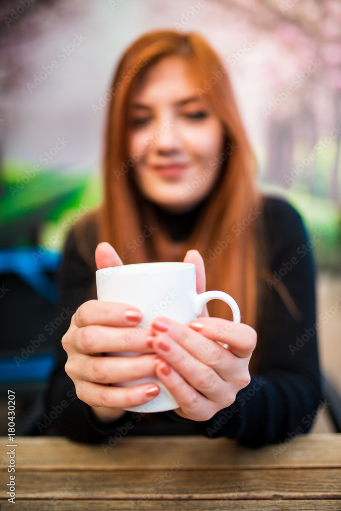 Beautiful girl drinking coffee at the coffee shop Beautiful girl drinking coffee at the coffee shop