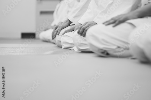 students sitting in a kimono in the gym