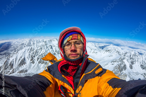 Selfi male climber in the snowy mountains