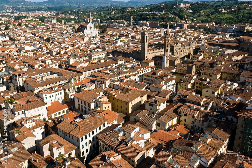 An aerial panoramic view of Florence from the top of the Campanile - Florence, Tuscany, Italy. You can see Church of Santa Croce and Bargello museum surrounded by the typical red roofs of the town
