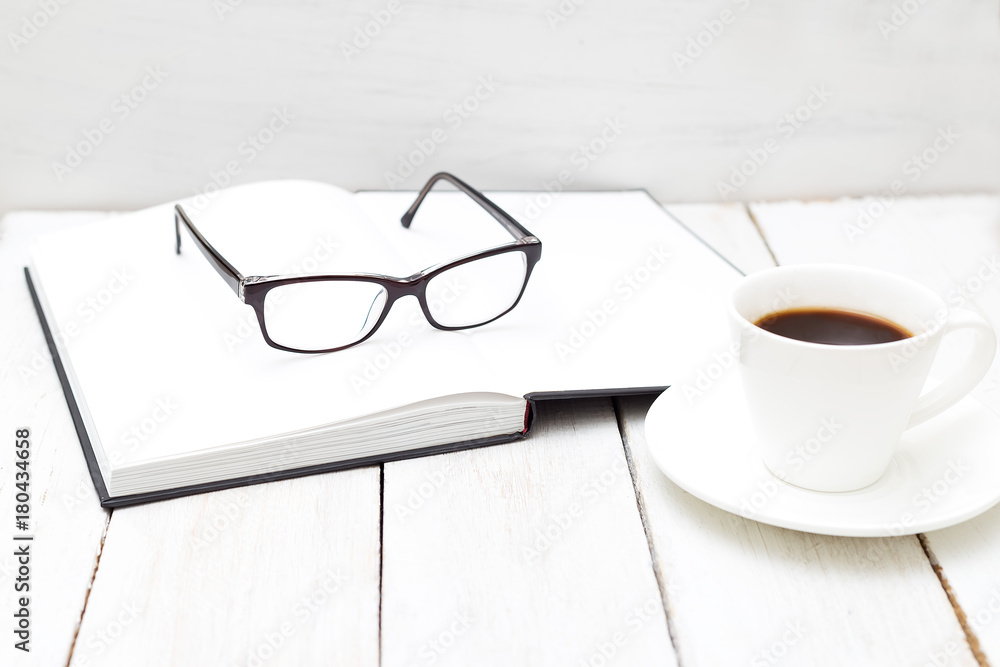 Books for study and glasses on a white background. Scandinavian design Books for study and glasses on a white background. Scandinavian design