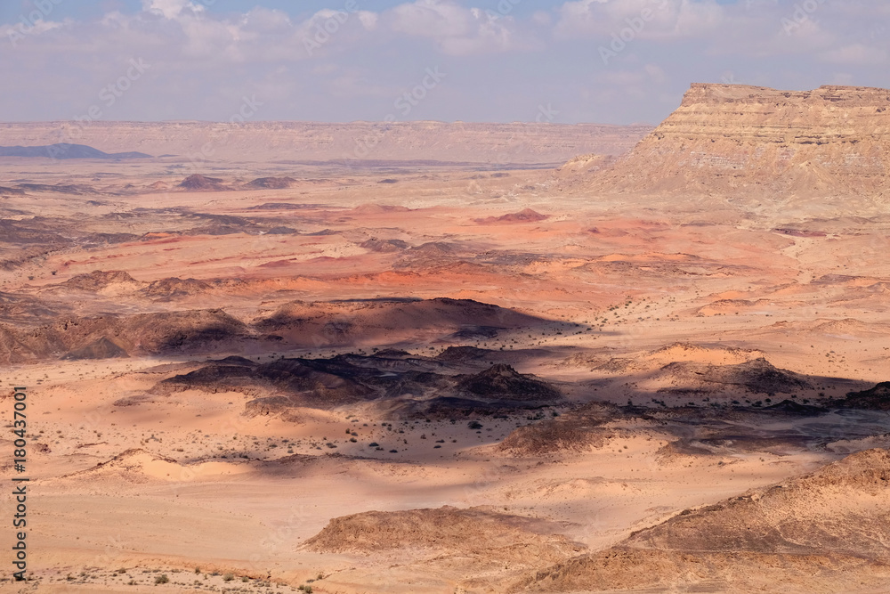 Naklejka premium Scenic aerial landscape of Crater Ramon and Ardon mountain in Negev desert.