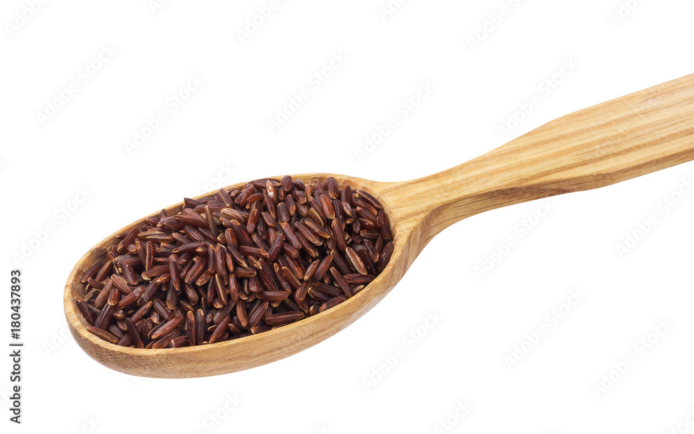 Red rice groats in wooden spoon isolated on white background Red rice groats in wooden spoon isolated on white background