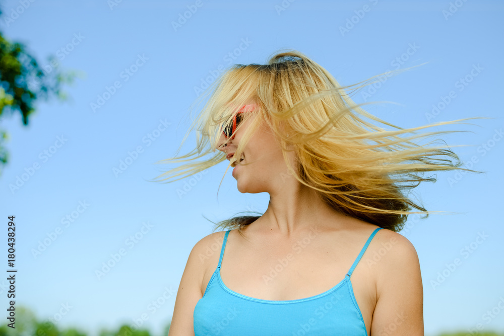 Attractive sexy blonde woman wear sunglasses posing in sunshine countryside copyspace outdoors background. Close up portrait of one caucasian joyful girl looking positive, bright emotional freshness