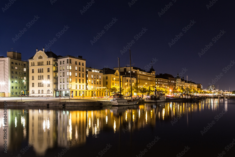 Reflection of Helsinki waterfront at night in Finland