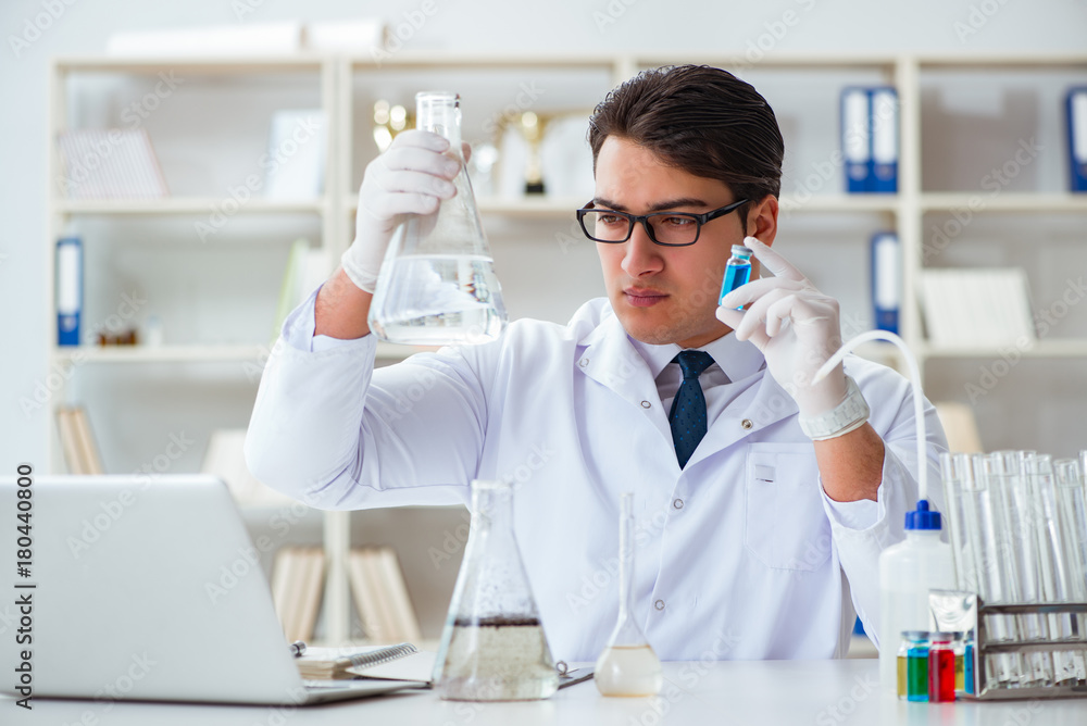 Young researcher scientist doing a water test contamination expe Young researcher scientist doing a water test contamination expe