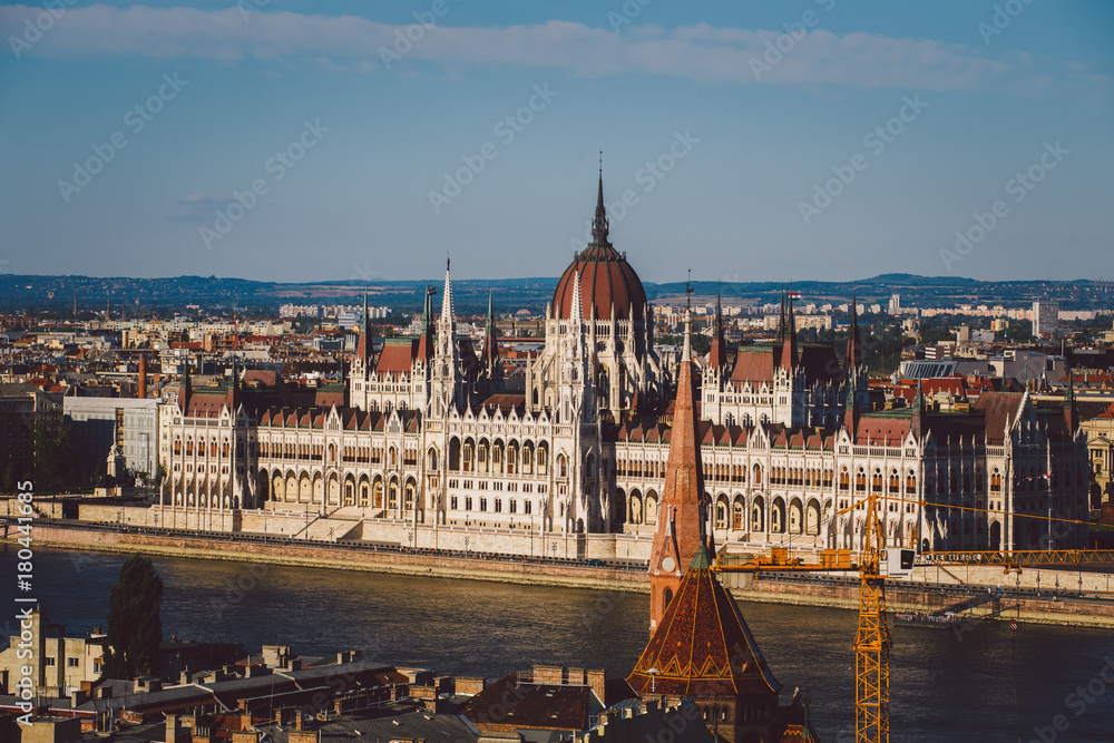 Evening sun on the facade of the Parliament building across Danube river, Budapest Hungary.