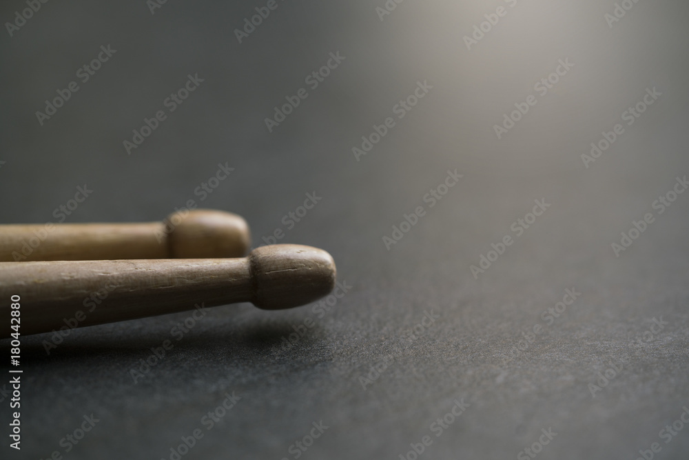 close up drum stick on black table background, music concept close up drum stick on black table background, music concept