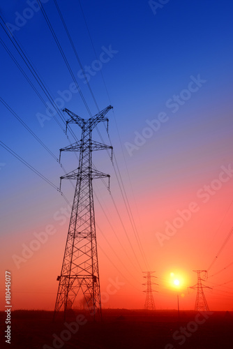 High piezoelectric towers, in the setting sun