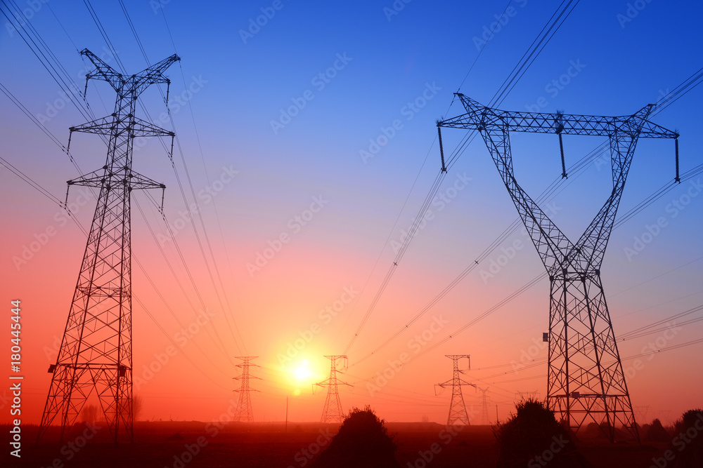 High piezoelectric towers, in the setting sun