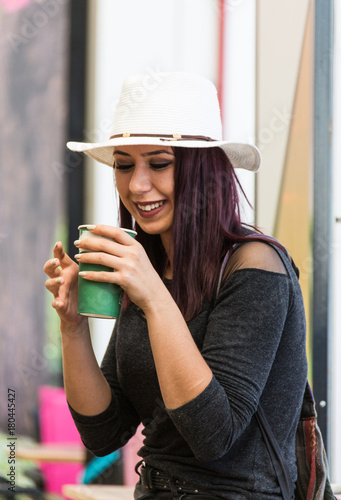 Beautiful girl drinking coffee at the coffee shop