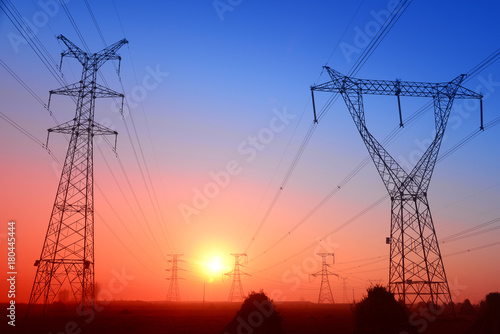 High piezoelectric towers, in the setting sun