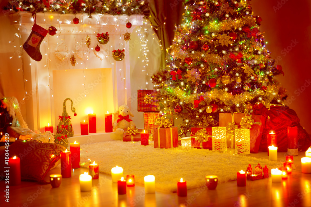 Christmas Tree, Presents Gifts and Fireplace in Holiday Home Room, Xmas Indoor Decoration in Candles Light