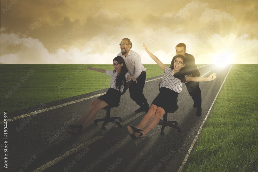 Business people racing on the asphalt road Business people racing on the asphalt road