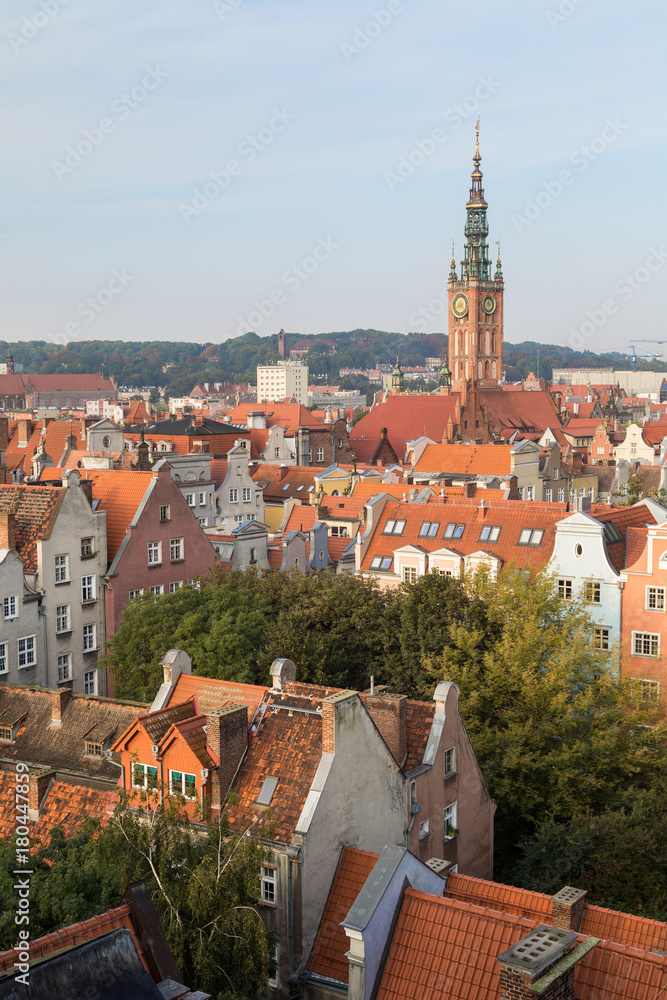 Old residential buildings and Main Town Hall's tower at the Main Town (Old Town) in Gdansk, Poland, viewed from above in the morning.