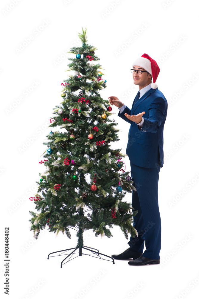Businessman decorating christmas tree isolated on white