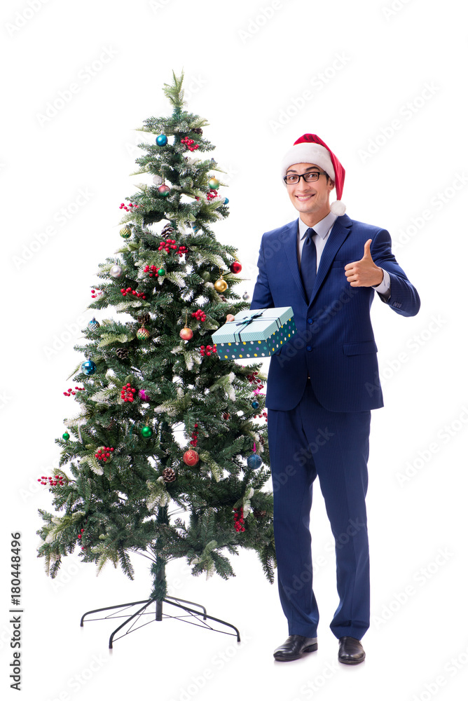 Businessman decorating christmas tree isolated on white Businessman decorating christmas tree isolated on white