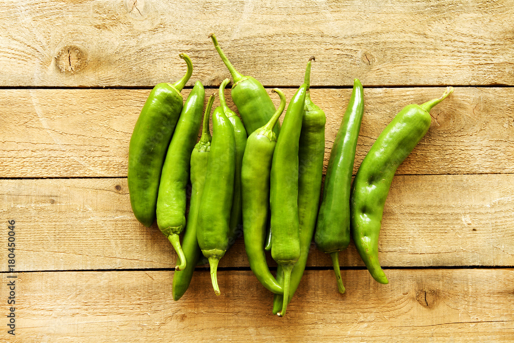 Green peppers on wood background Green peppers on wood background
