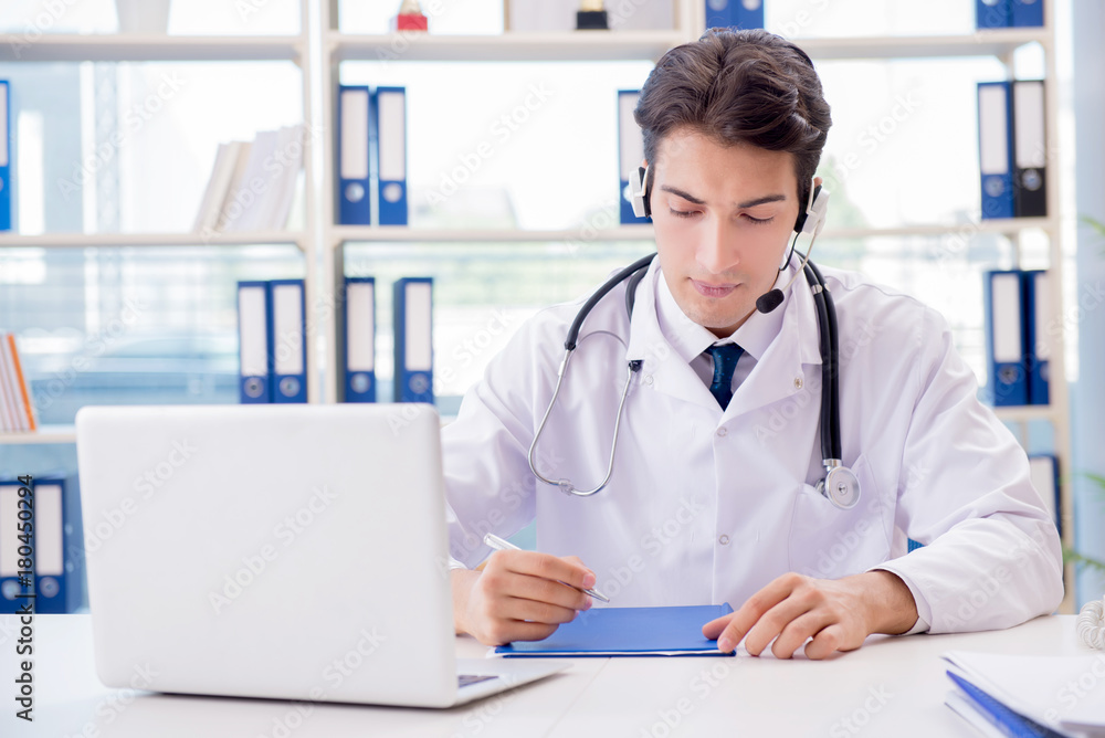 Young male doctor in telehealth concept Young male doctor in telehealth concept