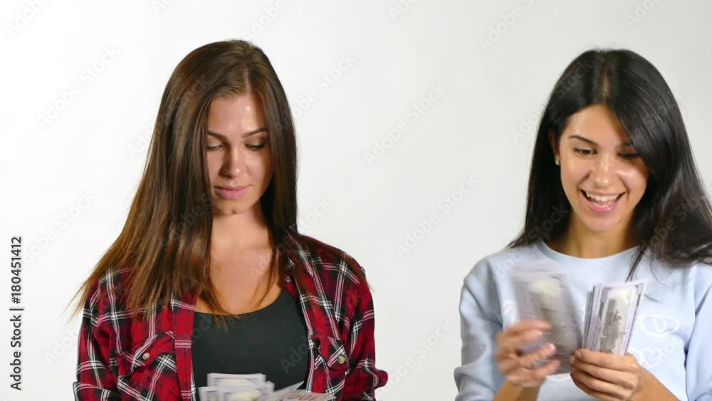 Couple of womans Standing In The Rain From Money. Slow Motion Couple of womans Standing In The Rain From Money. Slow Motion