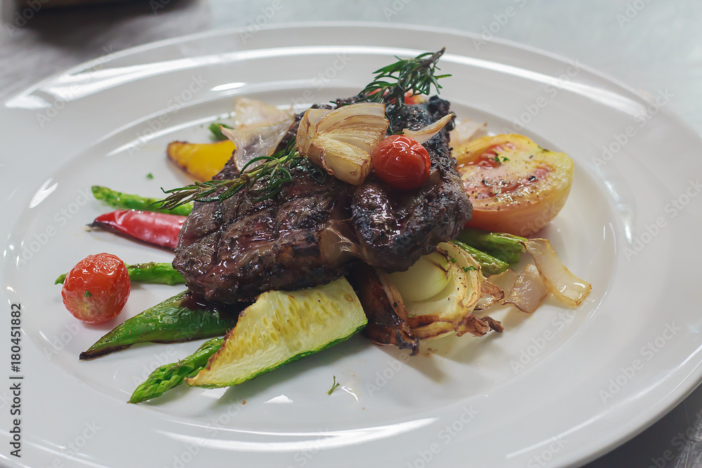 rip eye steak served with side dish asparagus, cucumber , tomato, dill, onion rip eye steak served with side dish asparagus, cucumber , tomato, dill, onion