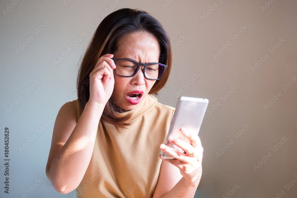 Portrait Asian woman in disappointed emotion. Concept of business woman used smart phone and fail something. Portrait Asian woman in disappointed emotion. Concept of business woman used smart phone and fail something.