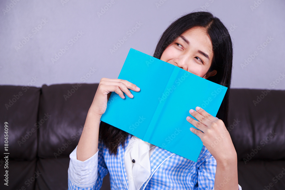business woman rests at the sofa and reading a book business woman rests at the sofa and reading a book