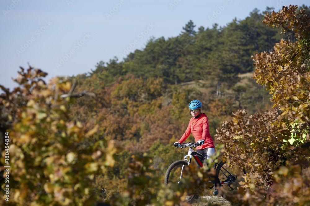 On the mountain. Full length shot of two female cyclists riding a trail.