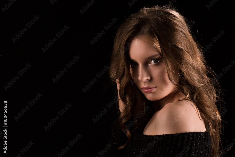 Portrait of young sexy light hair model woman posing on black background in studio Portrait of young sexy light hair model woman posing on black background in studio