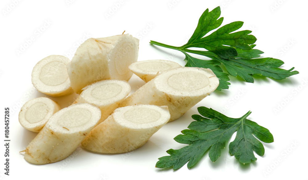 Sliced pieces of parsley with two fresh leaves isolated on white background. Sliced pieces of parsley with two fresh leaves isolated on white background.
