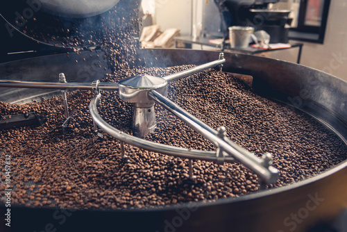 Slika na platnu Aromatic coffee beans situating in modern equipment with grain chiller