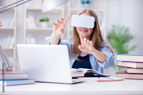 Young female student preparing for exams with VR glasses