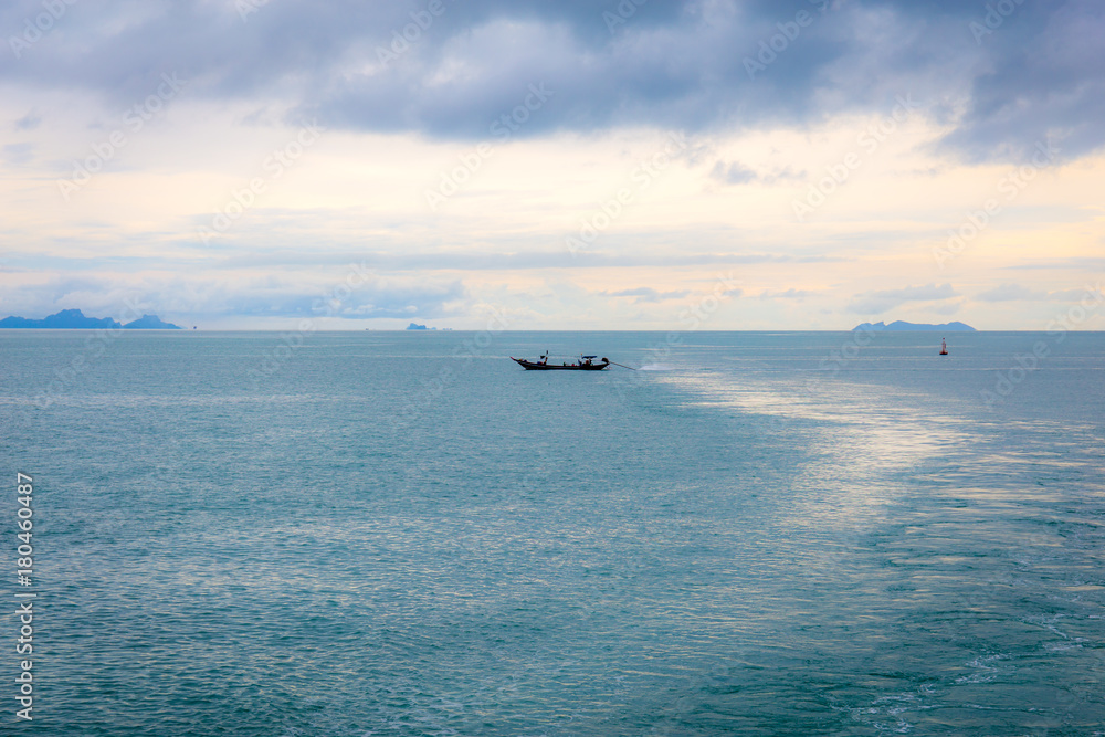 Thai long tail fishing boat fishing in the sea.