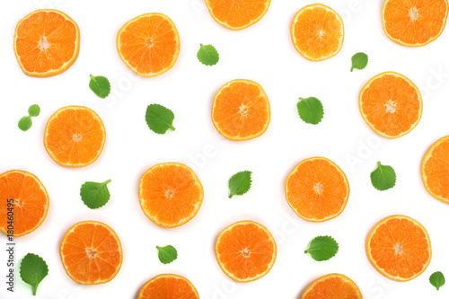 Slices of orange or tangerine with mint leaves isolated on white background. Flat lay, top view. Fruit composition