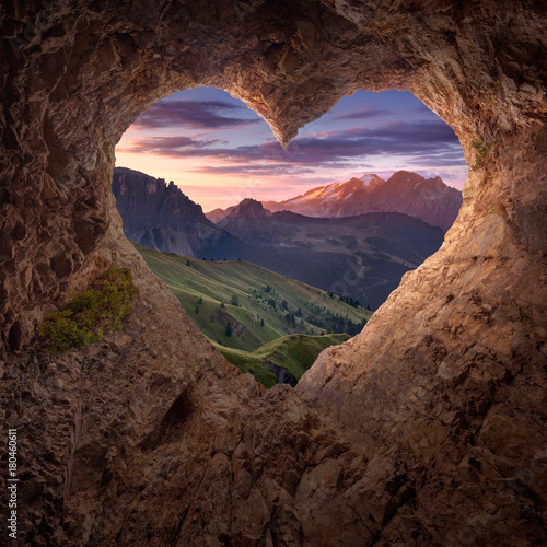 View from heart shape cave to the idyllic mountain scenery
