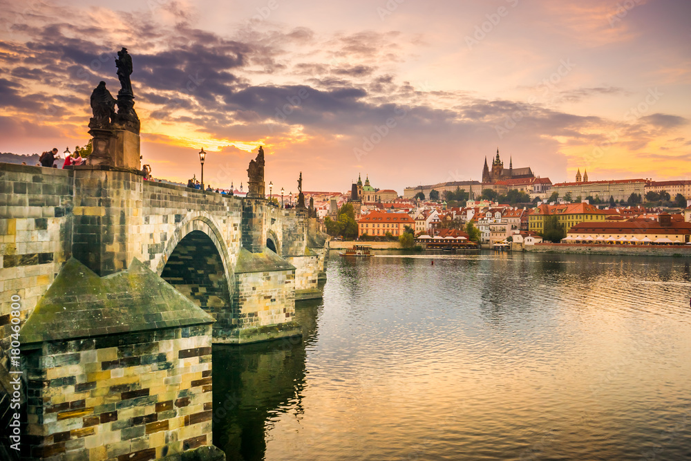 Charles Bridge in Prague and Prague Castle at sunset, Prague, Czech Republic in autumn Charles Bridge in Prague and Prague Castle at sunset, Prague, Czech Republic in autumn