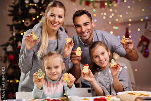 Happy family preparing Christmas biscuits