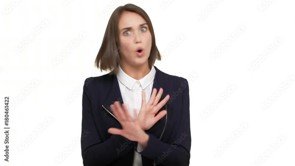 portrait of determined young woman with dark short hair expressing definite rejection feeling disgust don't want to accept gesturing with hands crossed making X shape saying NO over white background portrait of determined young woman with dark short hair expressing definite rejection feeling disgust don't want to accept gesturing with hands crossed making X shape saying NO over white background