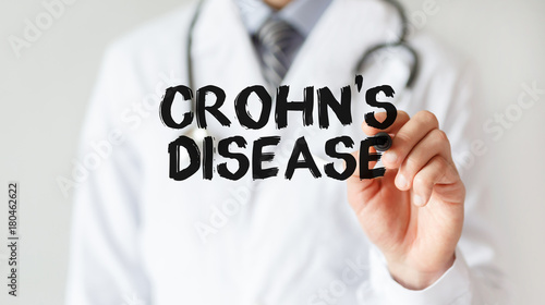 Doctor writing word Crohn's disease with marker, Medical concept photo