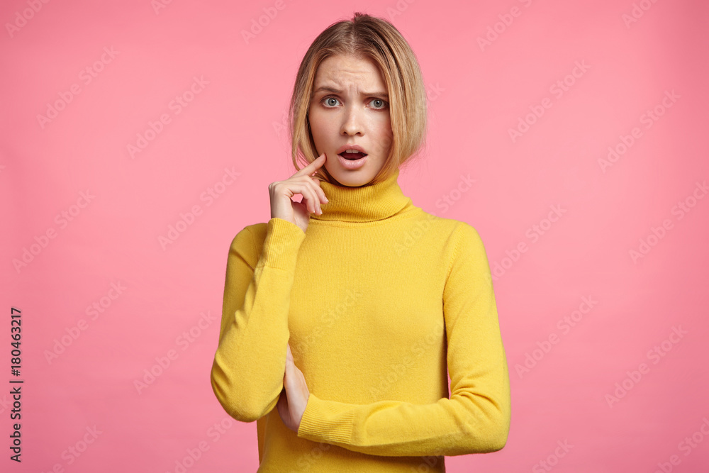 Waist up portrait of indignant female student being dissatisfied with results of exam or competition, can`t believe in such bad mistakes. Tired woman listens in displeasure lecture, keeps mouth opened Waist up portrait of indignant female student being dissatisfied with results of exam or competition, can`t believe in such bad mistakes. Tired woman listens in displeasure lecture, keeps mouth opened