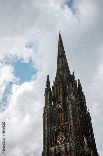 looking up towards the scott monument in Edinburgh on a cloudy day photo